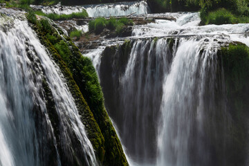 a magnificent waterfall called strbacki buk on the beautifully clean and drinking Una river in Bosnia and Herzegovina in the middle of a forest.