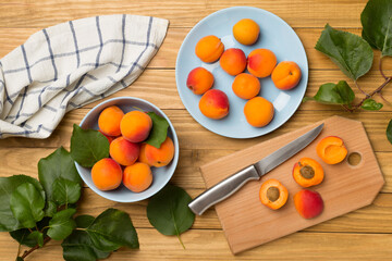 Composition with ripe apricots on wooden background, top view
