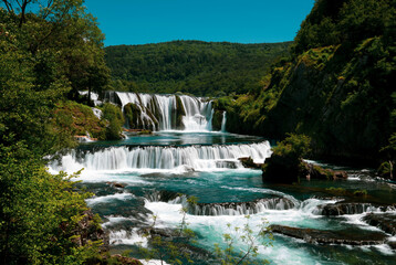 a magnificent waterfall called strbacki buk on the beautifully clean and drinking Una river in Bosnia and Herzegovina in the middle of a forest.