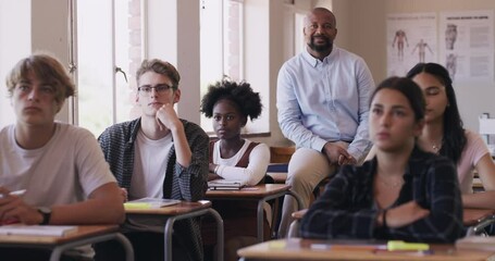 Learning, study and education with a teacher leading a presentation, teaching a class of young students. Happy, diverse learners, watching an educational programme with teacher, exam prepare