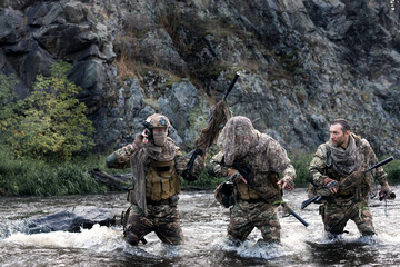 Mercenary soldiers ford a river during a special operation. COLLAGE - one model in three poses