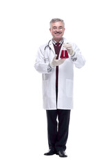 smiling doctor showing a flask with test results