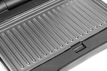 Ribbed surface of the electric grill. Grill non-stick coating.