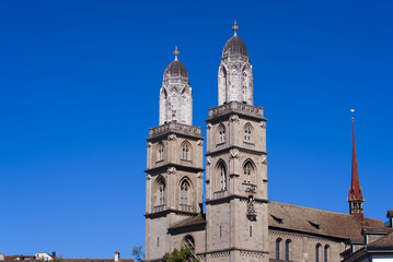Fototapeta na wymiar Protestant church Great Minster at the old town of Zürich at City of Zürich on a sunny summer day. Photo taken July 2nd, 2022, Zurich, Switzerland.