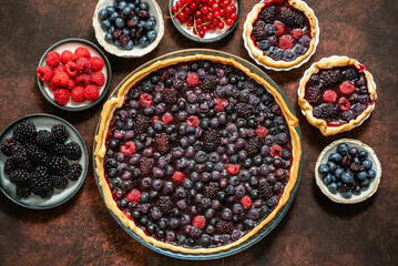 Homemade fresh round cake tart with berries, raspberries, blackberries