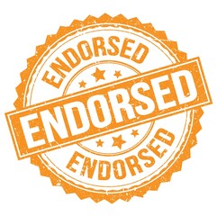ENDORSED text on orange round stamp sign