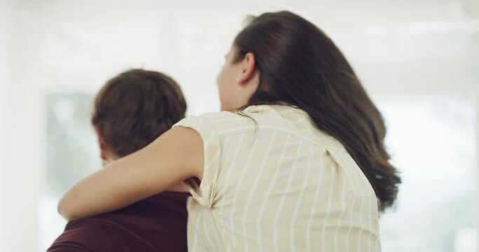 Carrying, love couple and happy fun with playful, bonding and funny people in home room. Safety, trust and smile on comic man holding a woman in spinning piggyback game and laughing in house interior