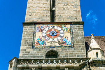 Brasov,Romania - August 20 2022: Black Church Clock on wall in Brasov, Romania