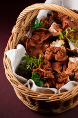 morel mushrooms on a burgundy background