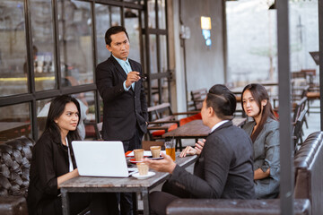 portrait of asian business people having an argument during meeting with partner