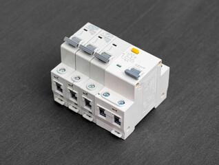 Electrical circuit breakers on a gray background, close-up. Designed for switching electrical circuits and their protection.
