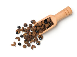 Top view of dried Sichuan pepper with wooden scoop isolated on white background.