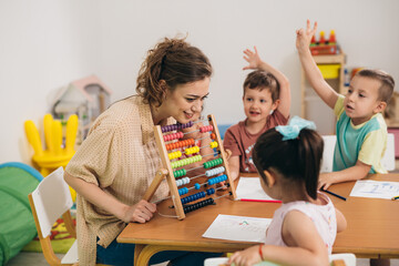 teacher working with kids in day care