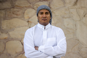 Portrait of an Arab man with a serious expression.