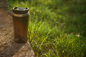a thermos for hot drinks on a hike or a walk in the park