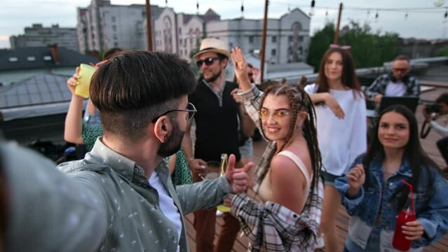 Roof party disco music festival friends dancing selfie POV video photo shooting drinking cocktail