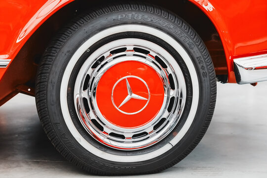 21 July 2022, Dusseldorf, Germany: The wheel and tire of a luxury Mercedes-Benz sports vintage car with a powerful braking system and discs.