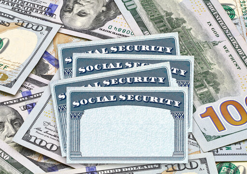Blank U.S. Social Security Cards on dollar bills 