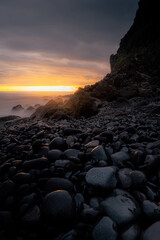 Long exposure waves hitting the coast of Madeira at Ponta do Sol during a summer sunset