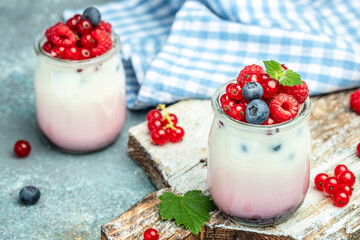 Healthy layered dessert with yogurt, jam, red currant and blueberries. Natural detox. banner, menu, recipe place for text, top view