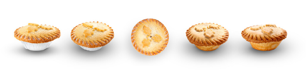 A collection of Christmas mince pies isolated against a flat background.