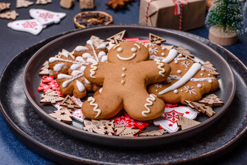 Christmas decorations and gingerbreads on a dark concrete table. Preparing and decorating the house for holiday