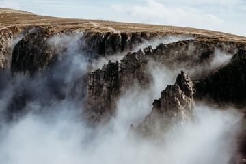 Clouds in the mountains. Fog in the mountans. Rocks. Clouds. Landscape.