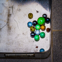 glass marbles in metal box