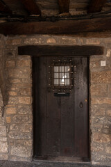 Fototapeta na wymiar old door in a street of ainsa in the spanish pyrenees