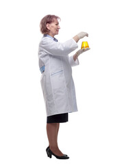 side view. senior female doctor with a laboratory flask . isolated on a white