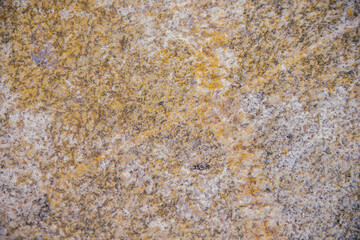 Stone gray textured background. Natural stone. The black background is a blank for the design. Uneven surface.