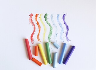Multi-colored pastel crayons on a white background. Rainbow Colors. Art materials for school and...