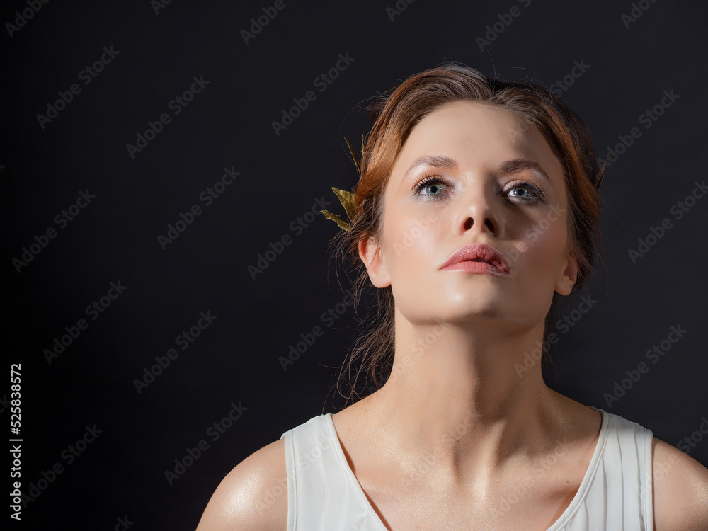 Wall mural a beautiful ancient goddess from the era of the heroes of hellas. a young woman in a white tunic and