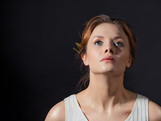A beautiful ancient goddess from the era of the heroes of Hellas. A young woman in a white tunic...