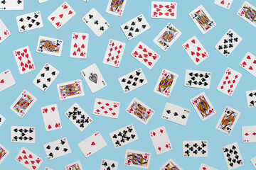 Playing cards collection, creative pattern on pastel blue background. 