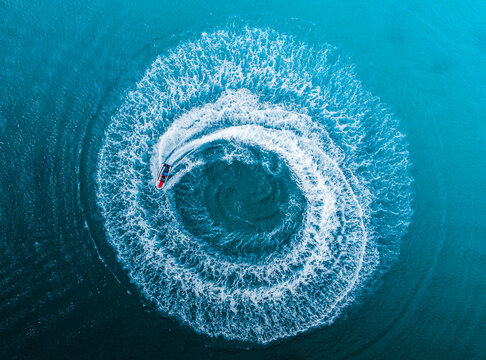 Ocean shot with a circle of water motion drone wallpaper created by a jetski from puerto rico luquillo la monseratte beach.