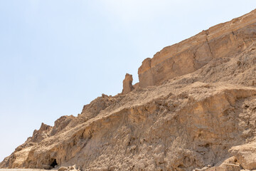 Fototapeta premium Lots wife - Eshet Lot is a rock salt column on Mount Sodom - Sdom - on coast of Dead Sea in Israel. Reminiscent of shape of a woman dressed in a veil. Traditionally perceived as petrified wife of Lot