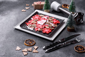 Christmas decorations and gingerbreads on a dark concrete table. Getting ready to celebration