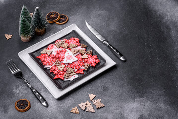 Christmas decorations and gingerbreads on a dark concrete table. Getting ready to celebration