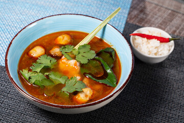 tom yum soup with rice and chili pepper