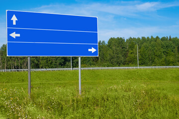 Directions signposts. Roadside sign to show way. Road sign with direction arrows. Roadside sign without text. Place for inscription. Direction signposts on nature background. Copy space on signposts