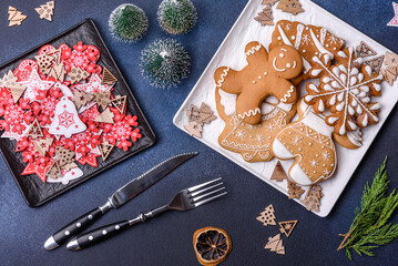 Christmas decorations and gingerbreads on a dark concrete table. Getting ready to celebration