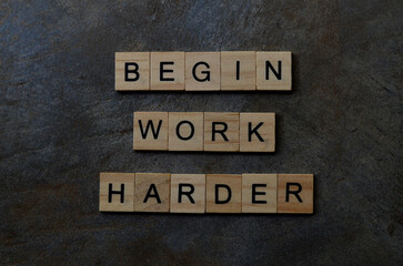 begin work harder text on wooden square, business motivation quotes