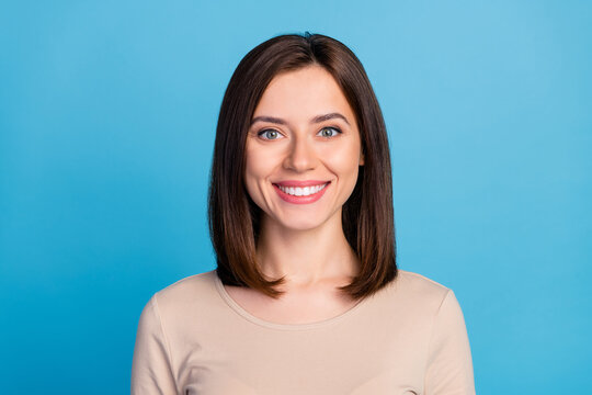 Portrait of satisfied glad person toothy beaming smile look camera isolated on blue color background