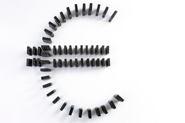 Euro currency symbol made from black domino tiles