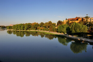 Fototapeta na wymiar Riverside park along Zayandeh river in Isfahan, Iran. 