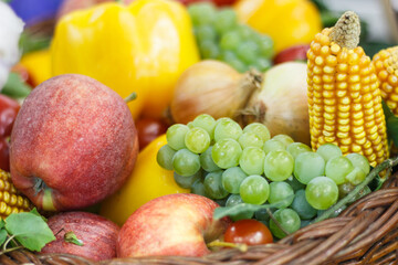 Fresh fruits and vegetables in basket as source healthy vitamins and minerals