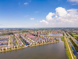 Drone point of view on Carbon Neutral Residential Neighbourhood in Heerhugowaard, North Holland,...