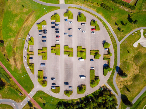 Drone Point of View on Round Parking Lot near a Public Park