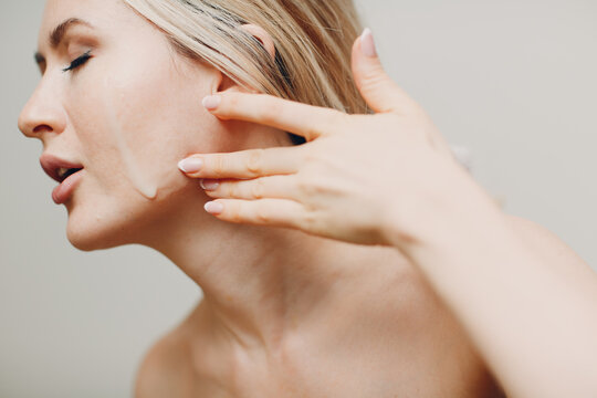 Cosmetic Oil Royal Jelly Applying On Face Of Young Woman